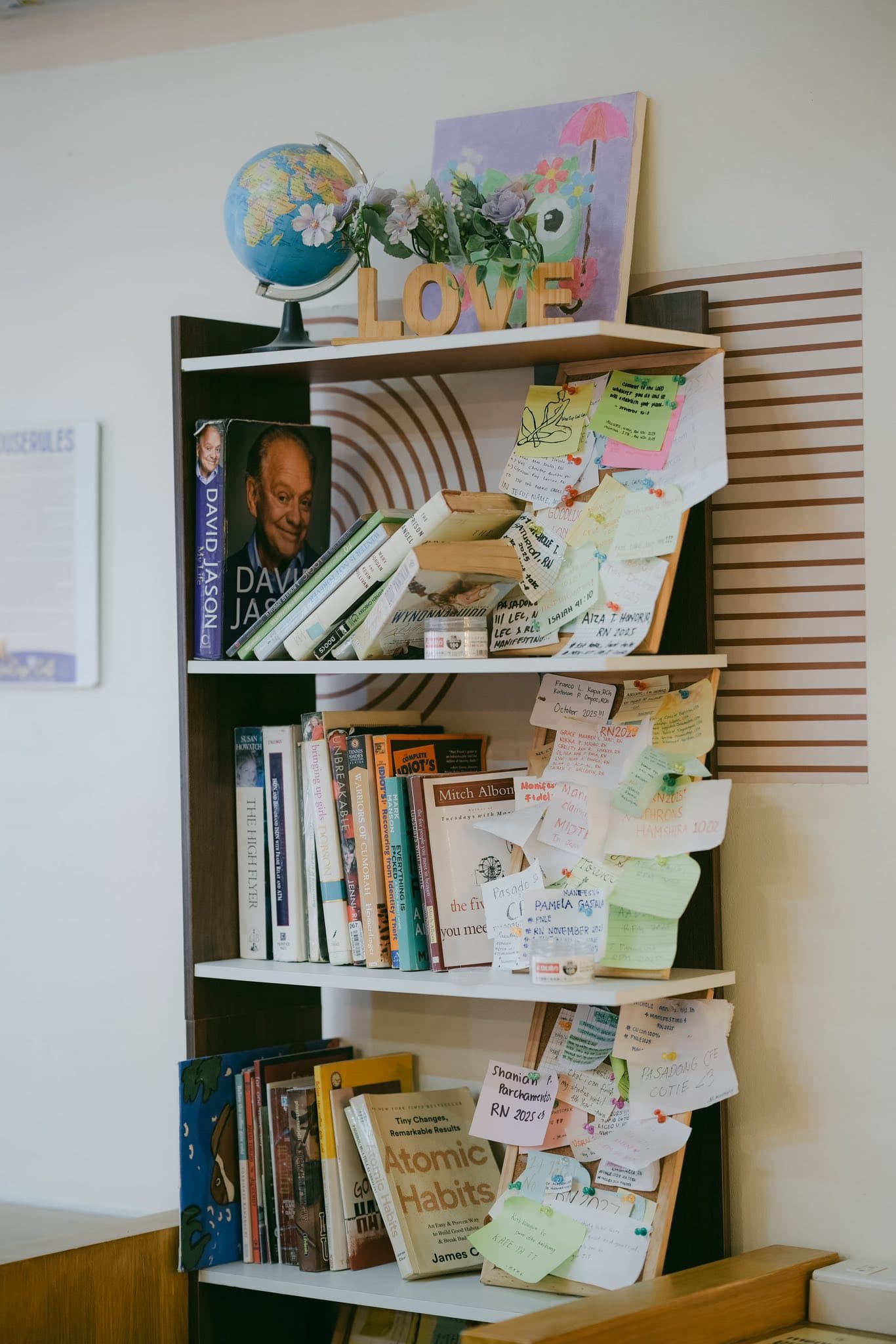 Bookshelf and community notes inside WeeCup Call Cafe